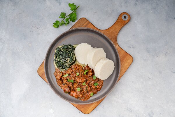 Traditional ugali with vegetables and meat